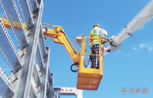 有了新“工友”　大桥检修快多了